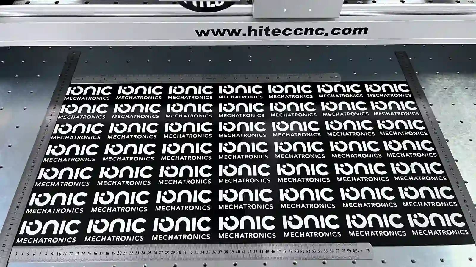 multiple metal parts marked with large format fiber laser